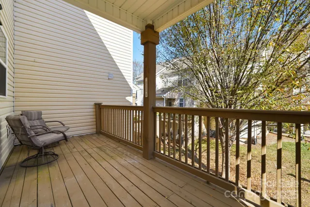 a view of a chairs on wooden deck