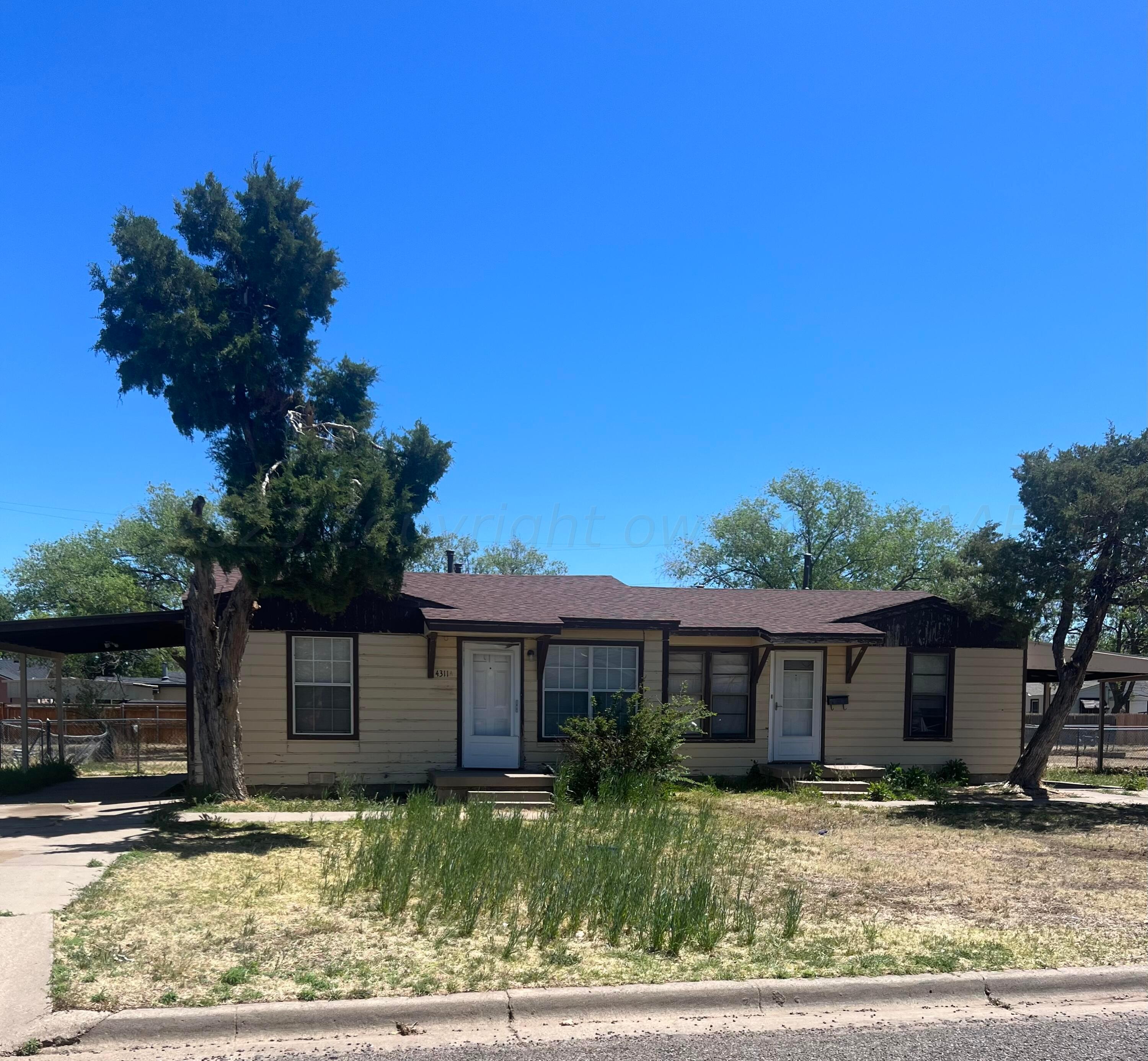 4311 South Lipscomb Street Amarillo, TX 79110 - Photo 1 of 1 a front view of a house with garden