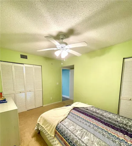 a bedroom with a bed and a cabinets