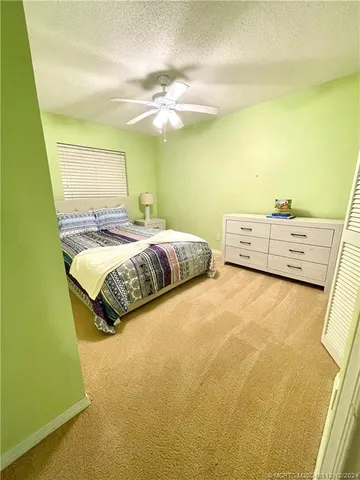 a bathroom with a sink a toilet a vanity and mirror