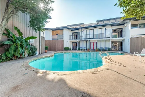 front view of a house with a swimming pool
