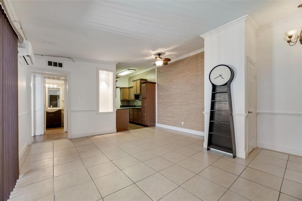 2627 Douglas Avenue, Unit 205 Dallas, TX 75219 - Photo 5 of 17 a view of a kitchen with furniture and a refrigerator