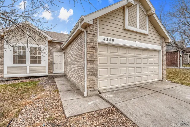 a view of a house with a door and a window
