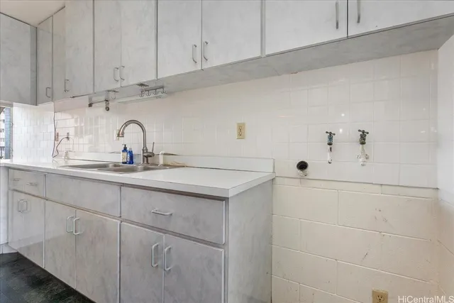 a kitchen with white cabinets