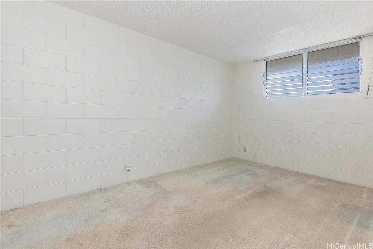 1420 Victoria Street, Unit 1301 Honolulu, HI 96822 - Photo 17 of 20 an empty room with windows