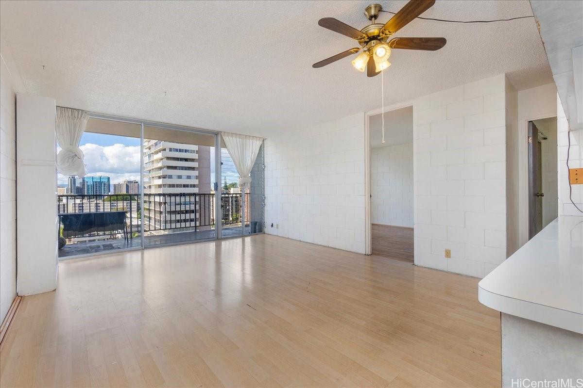 1420 Victoria Street, Unit 1301 Honolulu, HI 96822 - Photo 3 of 20 wooden floor in an empty room with a window