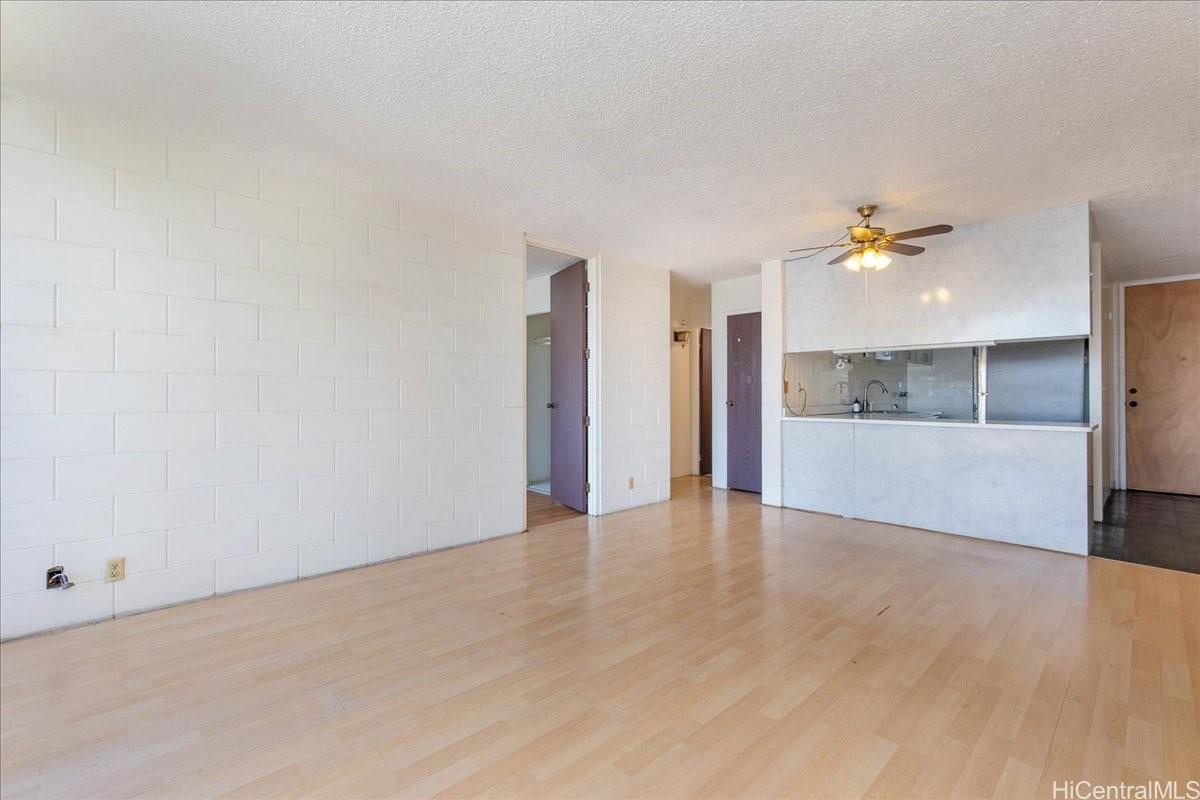 1420 Victoria Street, Unit 1301 Honolulu, HI 96822 - Photo 5 of 20 a view of an empty room with a window