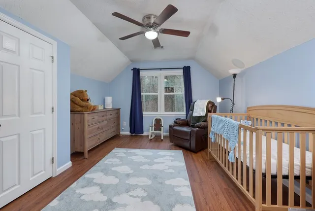 a living room with furniture windows and a chandelier