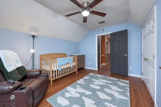 a bedroom with furniture and a chandelier