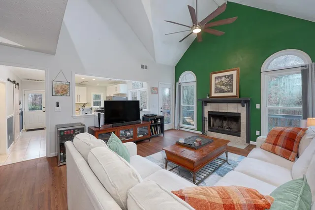 a living room with furniture and a fireplace