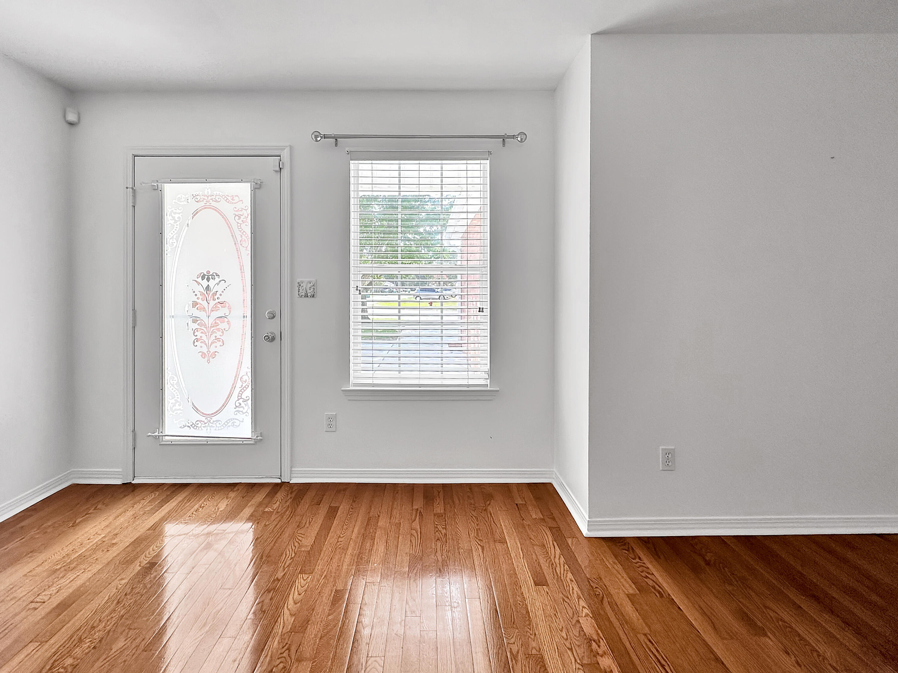 1770 Old Ranch Road Fort Walton Beach, FL 32547 - Photo 8 of 40 an empty room with wooden floor and windows