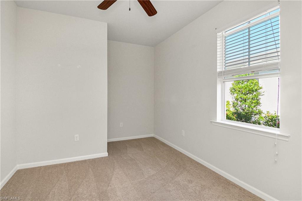 20179 Torch Key Way Estero, FL 33928 - Photo 12 of 25 an empty room with windows