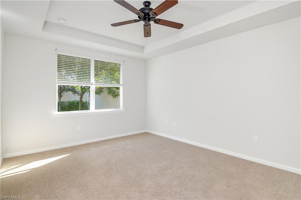 20179 Torch Key Way Estero, FL 33928 - Photo 13 of 25 an empty room with a window and a fan