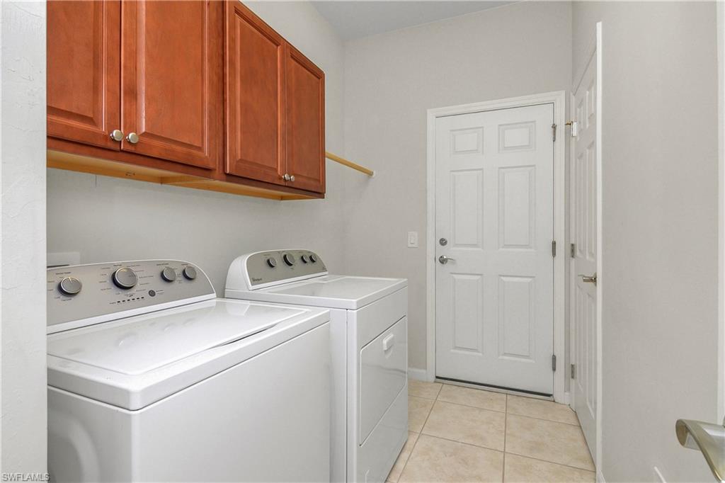 20179 Torch Key Way Estero, FL 33928 - Photo 16 of 25 a utility room with dryer and washer