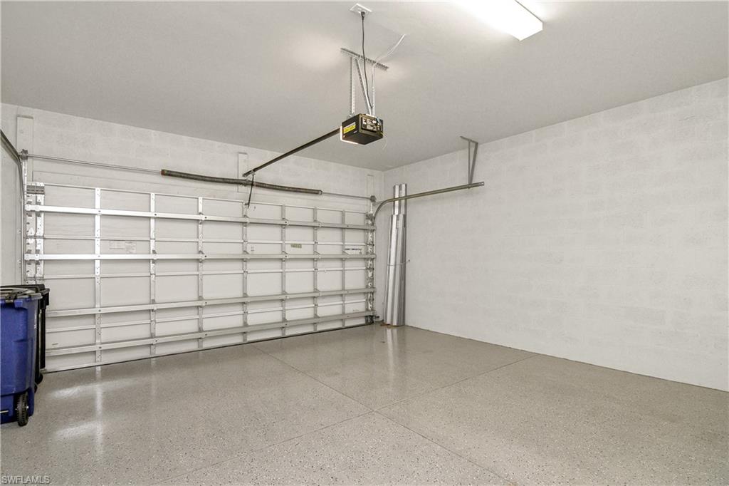 20179 Torch Key Way Estero, FL 33928 - Photo 17 of 25 a view of a garage