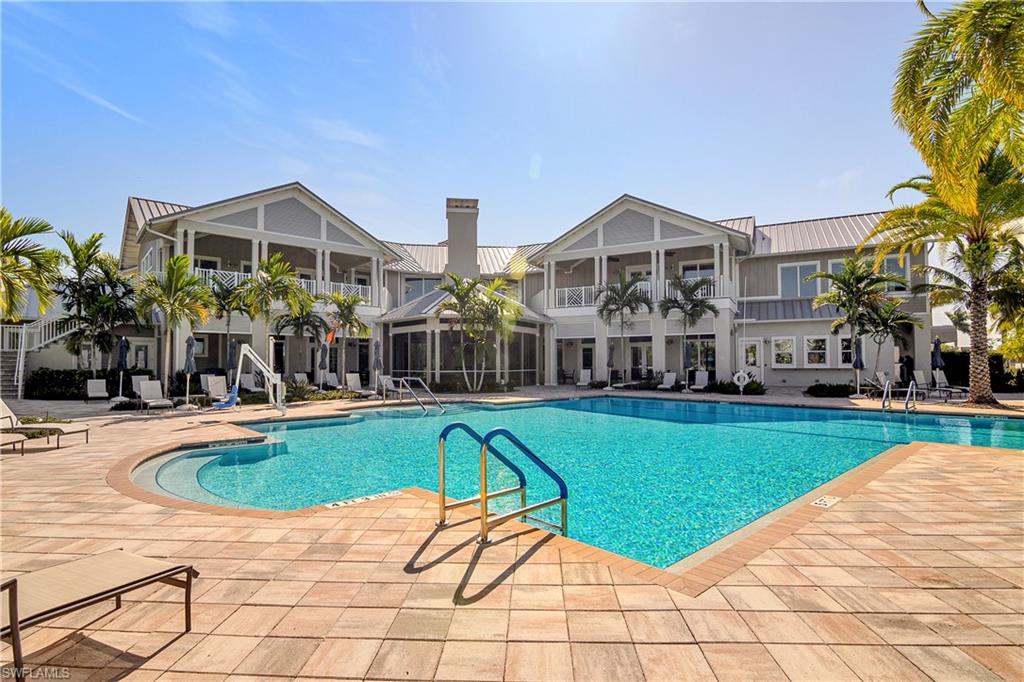 20179 Torch Key Way Estero, FL 33928 - Photo 19 of 25 a view of a house with a swimming pool and sitting area