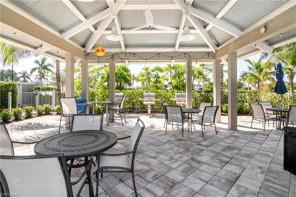20179 Torch Key Way Estero, FL 33928 - Photo 20 of 25 a view of a patio with table and chairs and potted plants