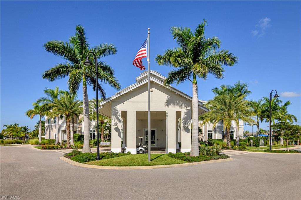 20179 Torch Key Way Estero, FL 33928 - Photo 21 of 25 a palm tree sitting in front of a house with a small yard