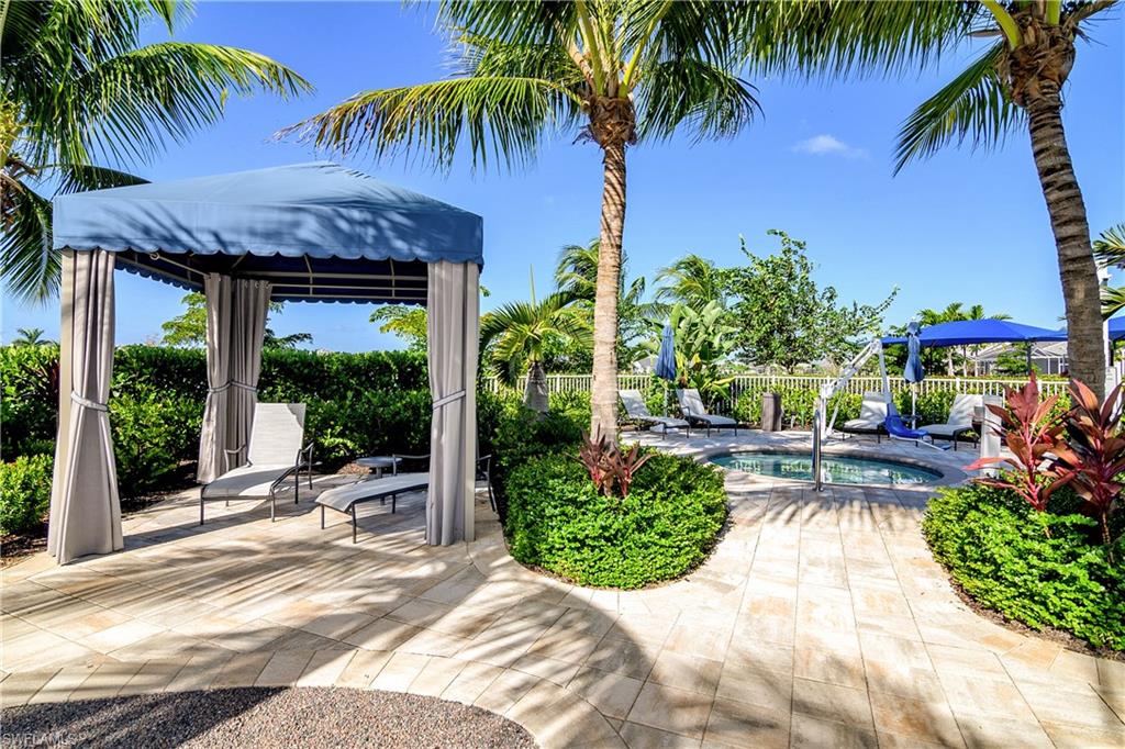 20179 Torch Key Way Estero, FL 33928 - Photo 23 of 25 a view of a backyard and a garden