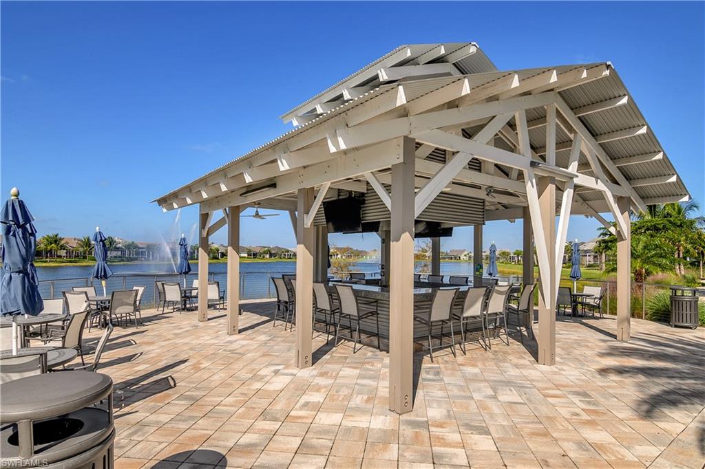 20179 Torch Key Way Estero, FL 33928 - Photo 24 of 25 a view of a large building with large windows