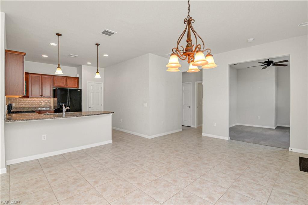 20179 Torch Key Way Estero, FL 33928 - Photo 6 of 25 a view of a kitchen with furniture and windows