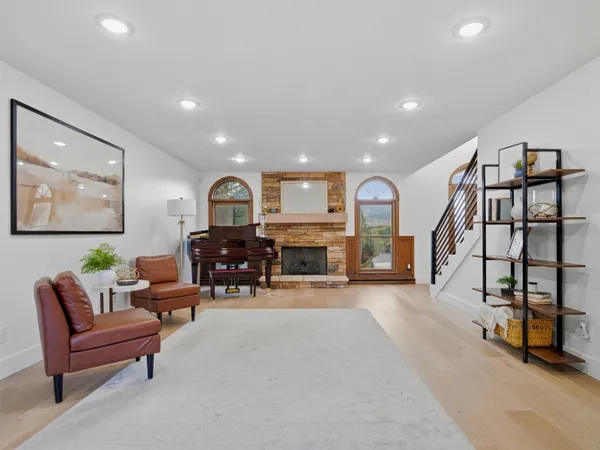 a living room with furniture and a large window