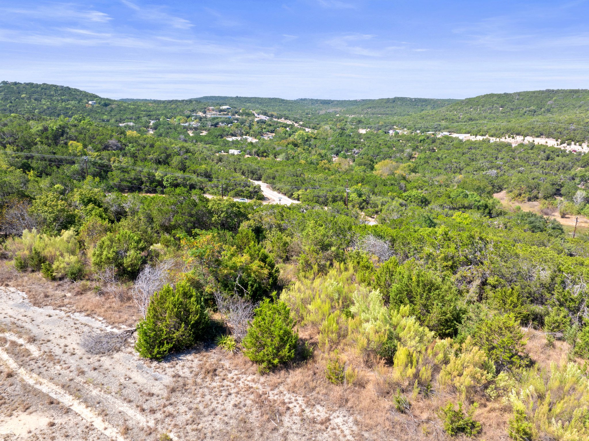 View of mountain backdrop with a heavily wooded area
