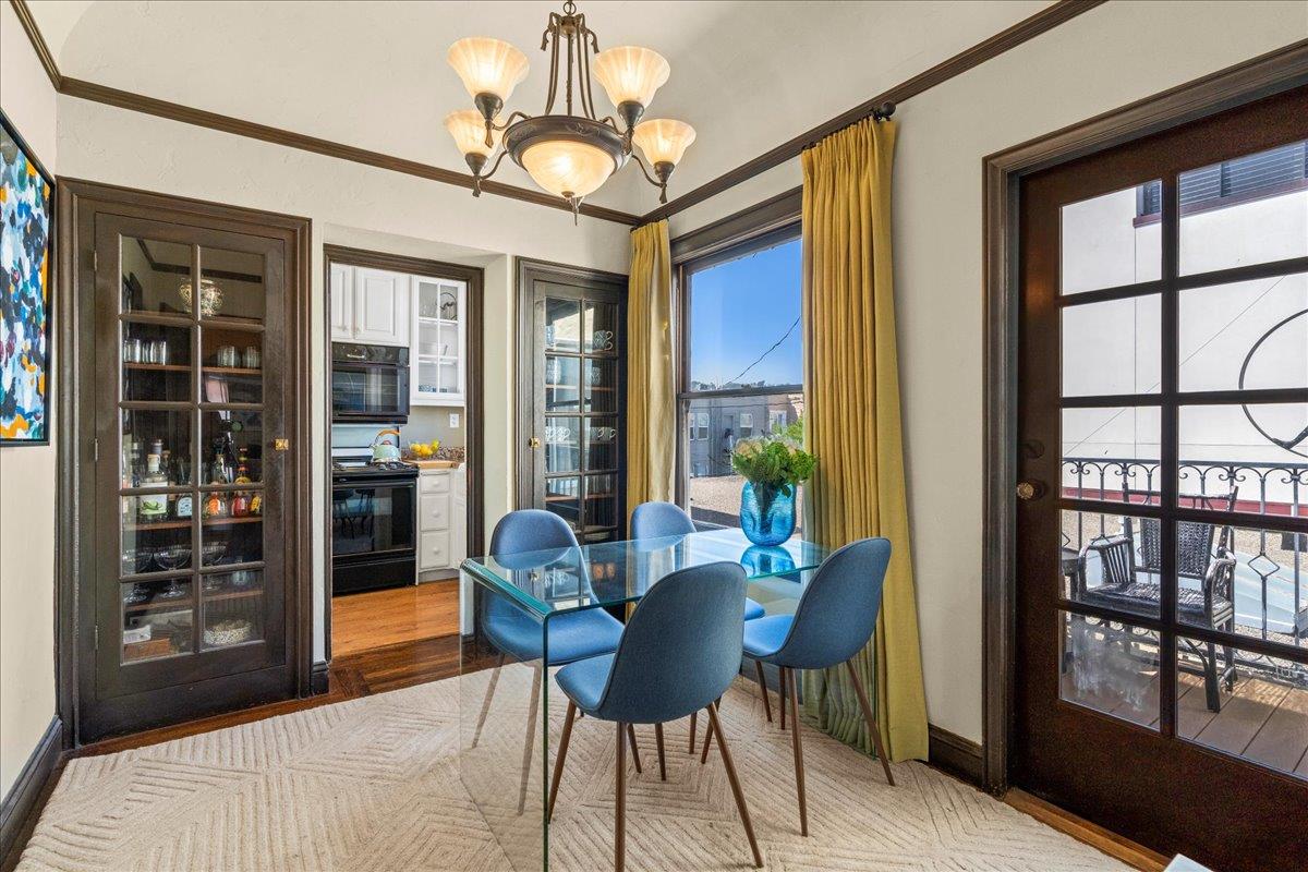 15 Rico Way, Unit 3 San Francisco, CA 94123 - Photo 16 of 46 a dining room with furniture a chandelier and wooden floor