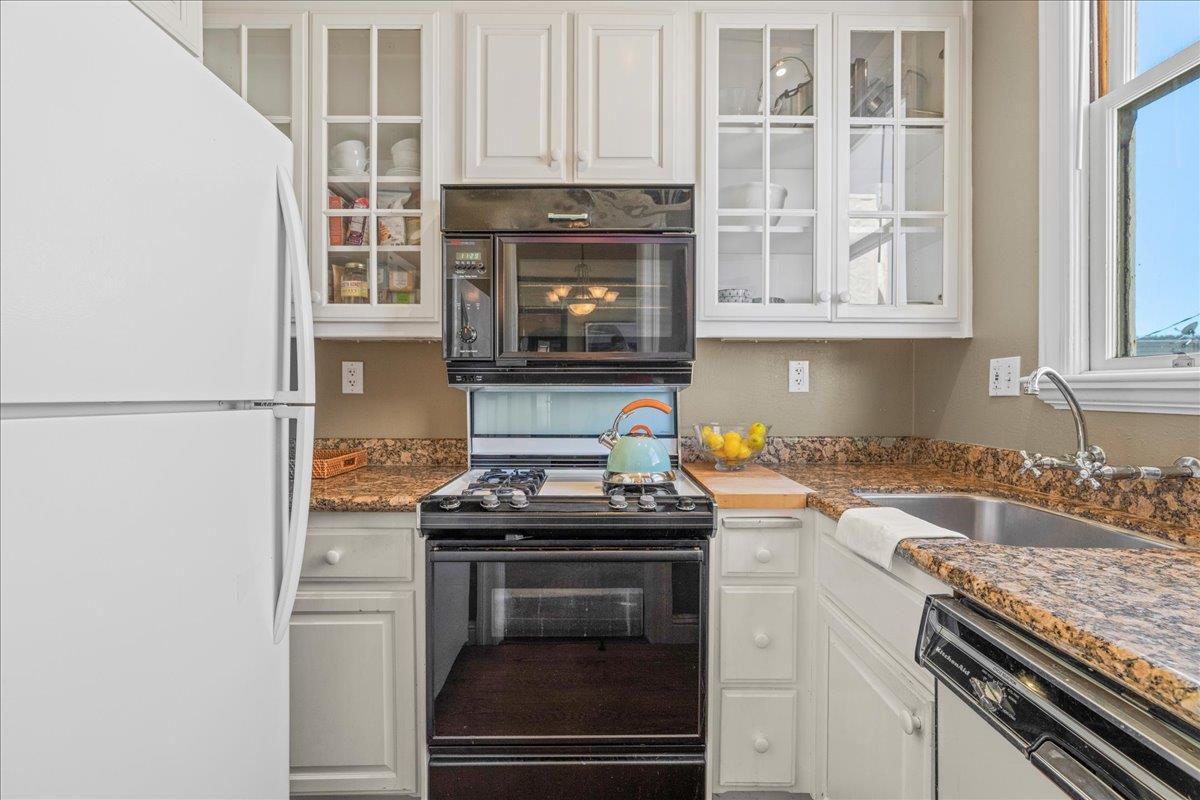 15 Rico Way, Unit 3 San Francisco, CA 94123 - Photo 19 of 46 a kitchen with granite countertop a stove and a sink