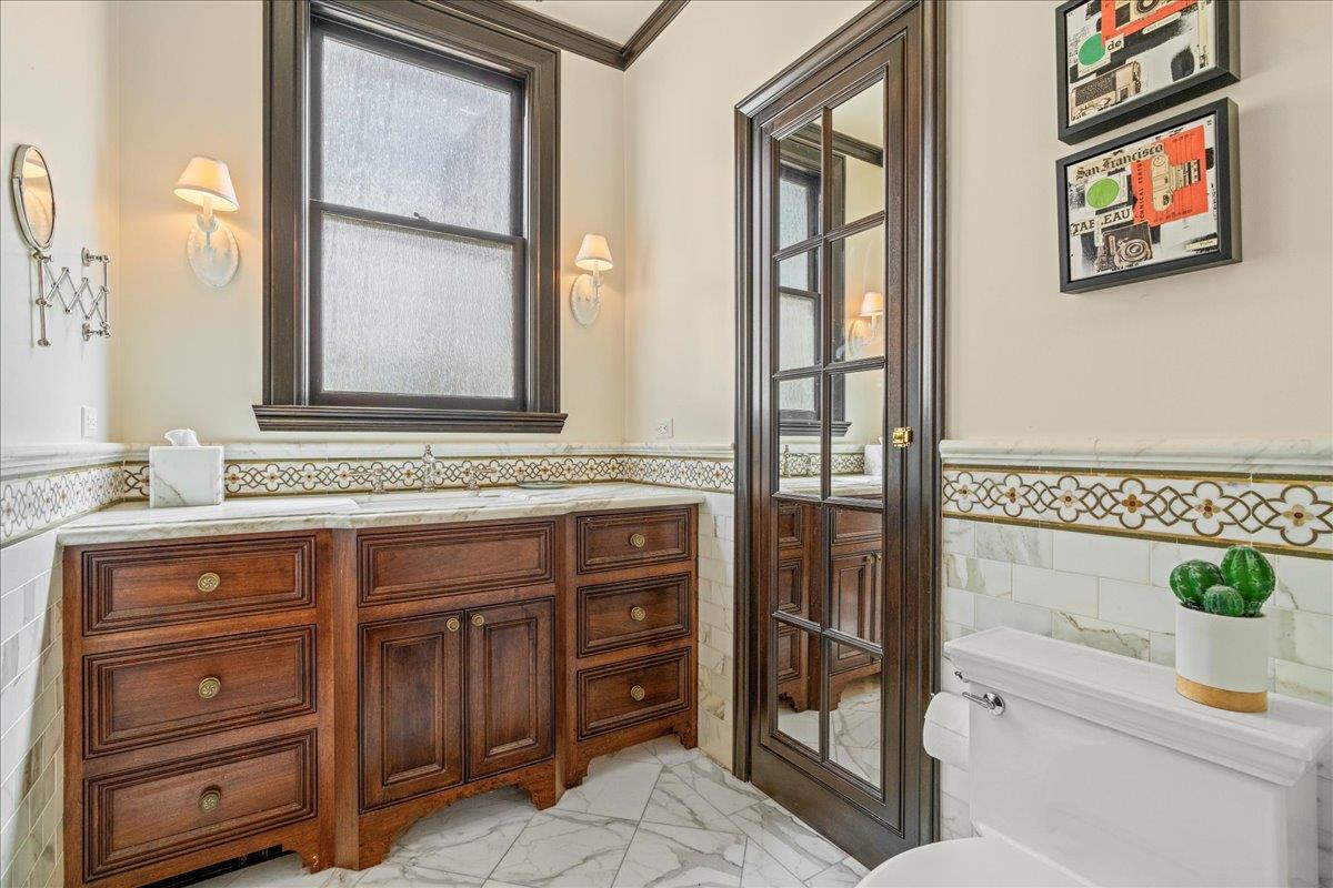 15 Rico Way, Unit 3 San Francisco, CA 94123 - Photo 23 of 46 a bathroom with a sink a mirror and a shower