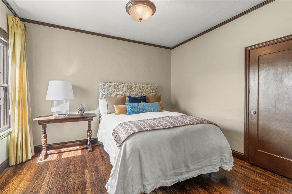 15 Rico Way, Unit 3 San Francisco, CA 94123 - Photo 26 of 46 a bedroom with a bed and wooden floor