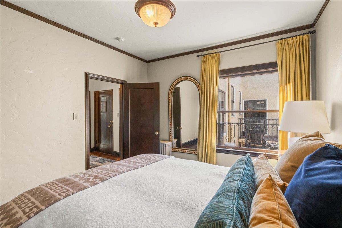 15 Rico Way, Unit 3 San Francisco, CA 94123 - Photo 27 of 46 a bedroom with a bed and a large window with outer view