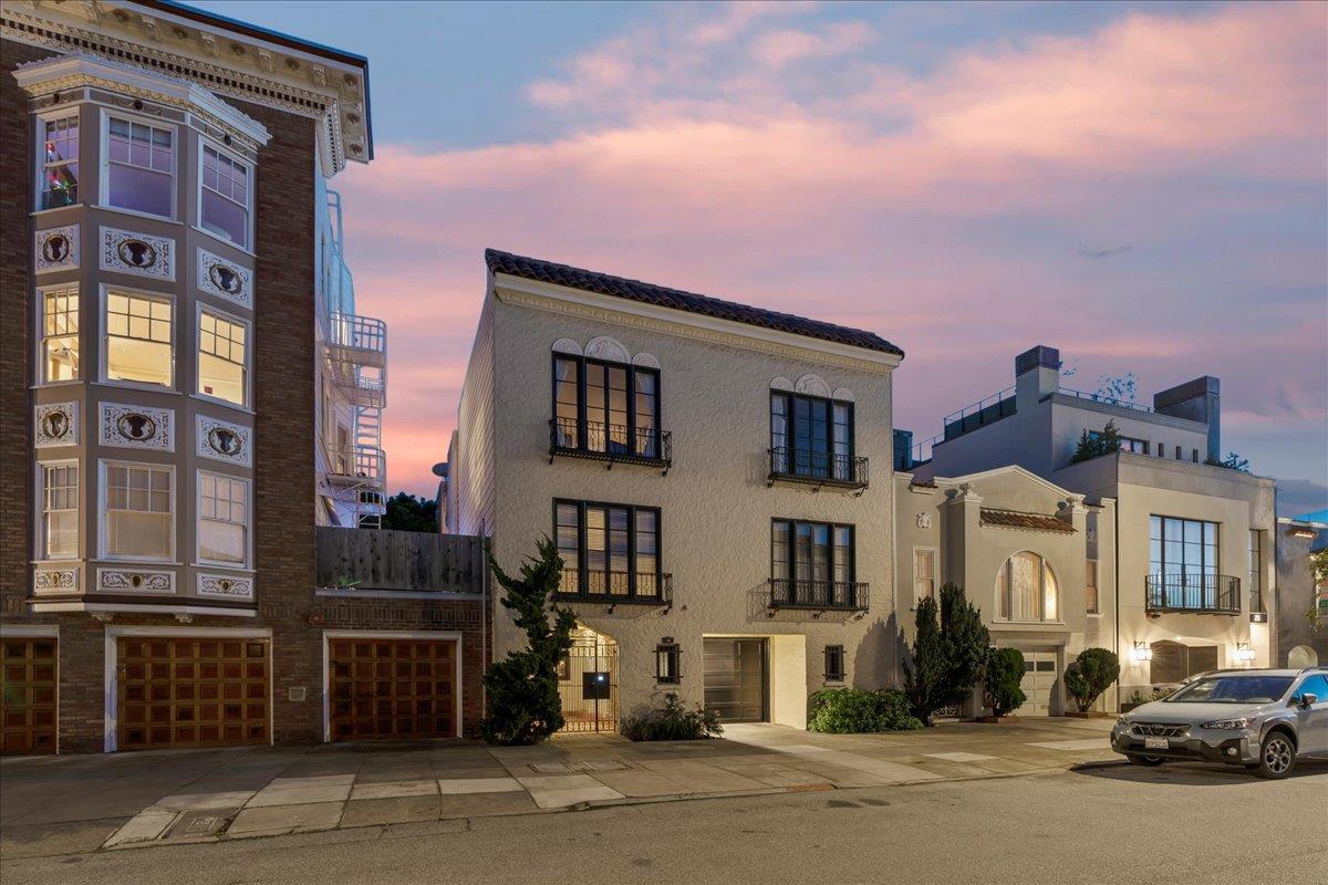 15 Rico Way, Unit 3 San Francisco, CA 94123 - Photo 3 of 46 a front view of a building with lot of cars and trees