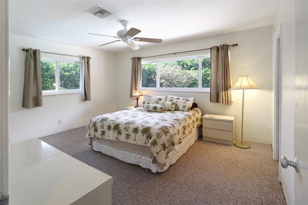 2517 Northeast 26th Terrace Fort Lauderdale, FL 33305 - Photo 15 of 42 a bedroom with a bed and a window