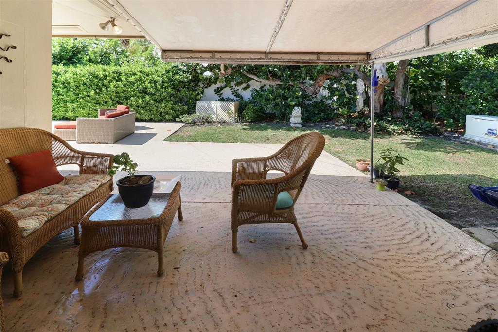 2517 Northeast 26th Terrace Fort Lauderdale, FL 33305 - Photo 21 of 42 a view of a backyard with sitting area