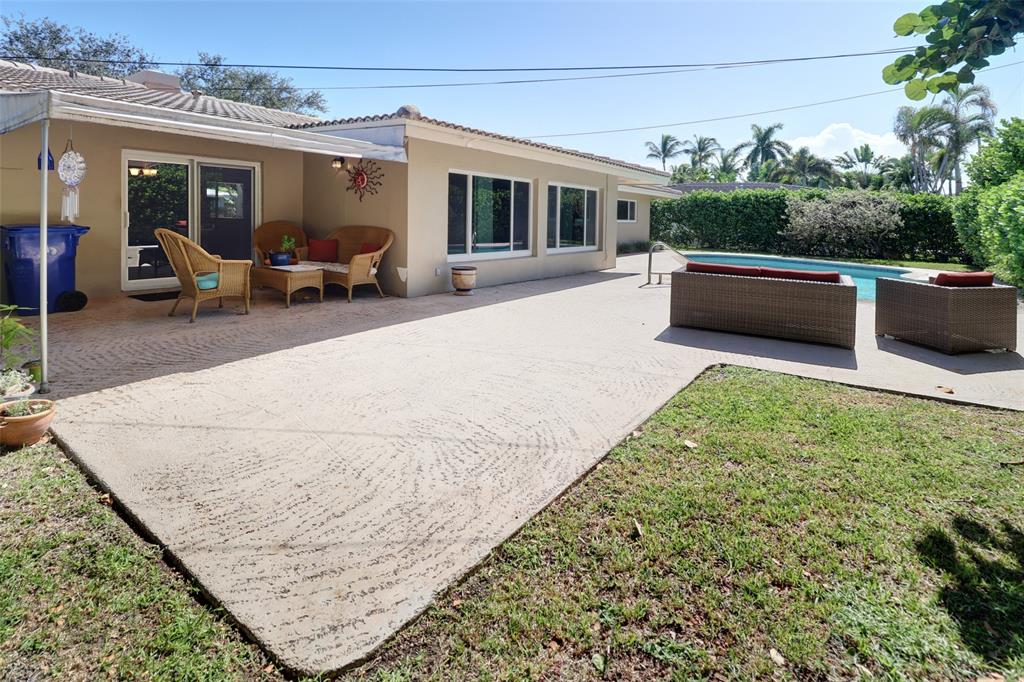 2517 Northeast 26th Terrace Fort Lauderdale, FL 33305 - Photo 22 of 42 a view of a patio with couches chairs and potted plants