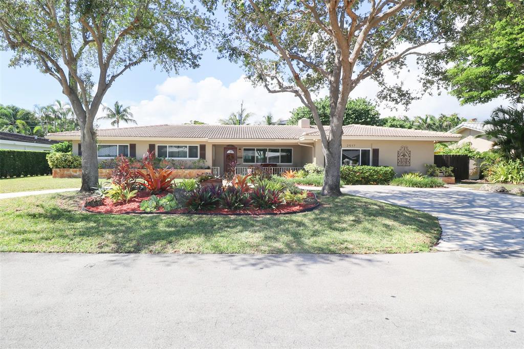 2517 Northeast 26th Terrace Fort Lauderdale, FL 33305 - Photo 34 of 42 front view of house with a yard