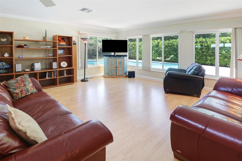 2517 Northeast 26th Terrace Fort Lauderdale, FL 33305 - Photo 7 of 42 a living room with furniture or window and a flat screen tv
