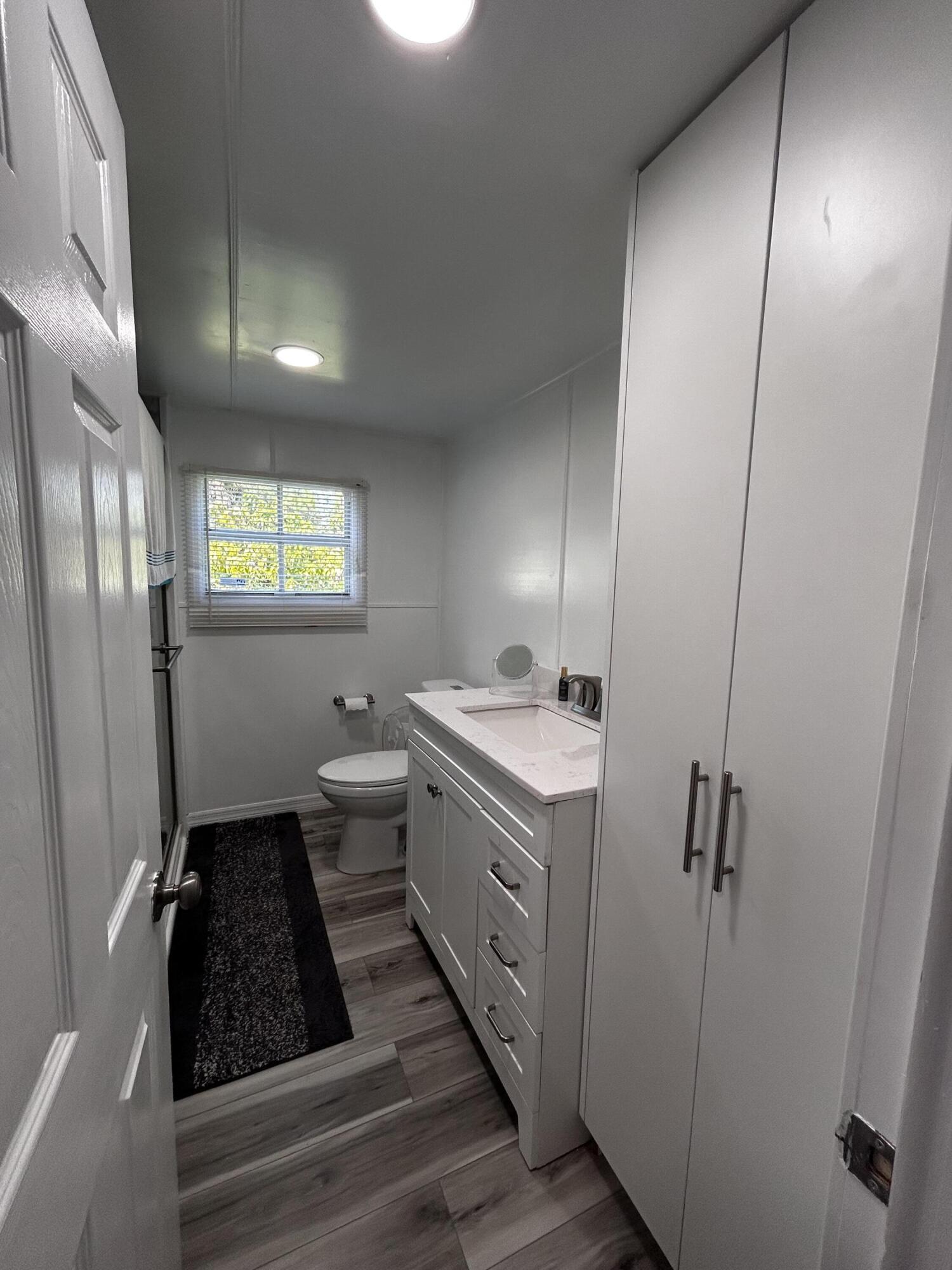 425 South Quebrada Street Clewiston, FL 33440 - Photo 12 of 56 a kitchen with a refrigerator and a sink