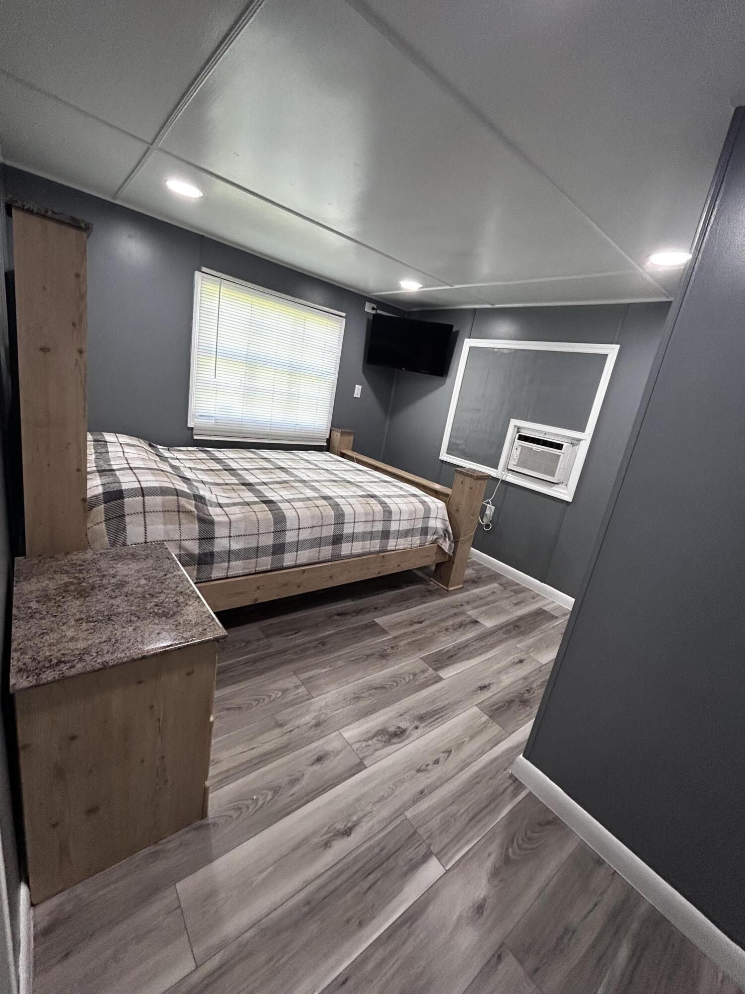 425 South Quebrada Street Clewiston, FL 33440 - Photo 15 of 56 a bedroom with bed and window