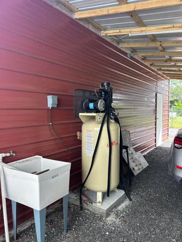 a view of a backyard with swimming pool