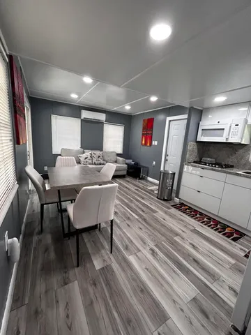 a kitchen with a stove a sink and a microwave