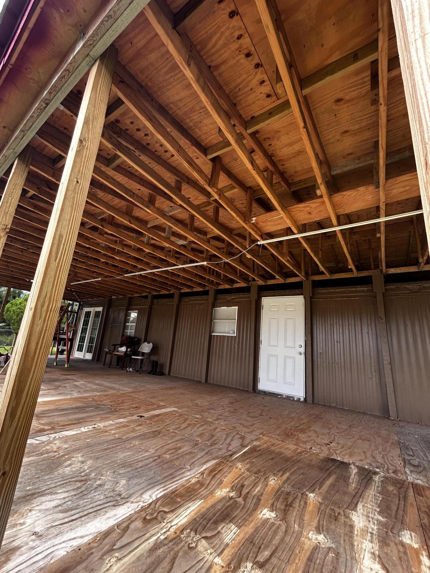 425 South Quebrada Street Clewiston, FL 33440 - Photo 44 of 56 a view of a room with wooden floor