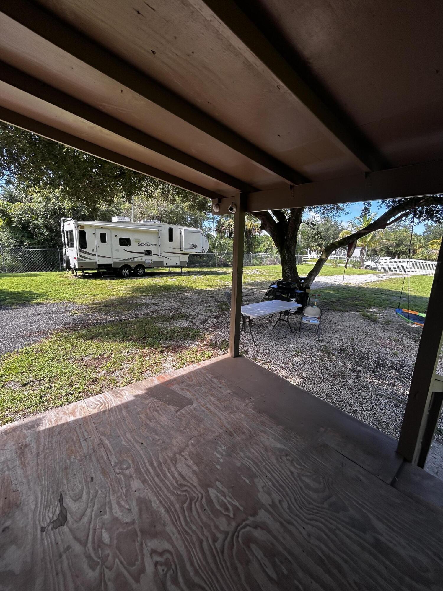 425 South Quebrada Street Clewiston, FL 33440 - Photo 45 of 56 a view of a swimming pool with a big yard