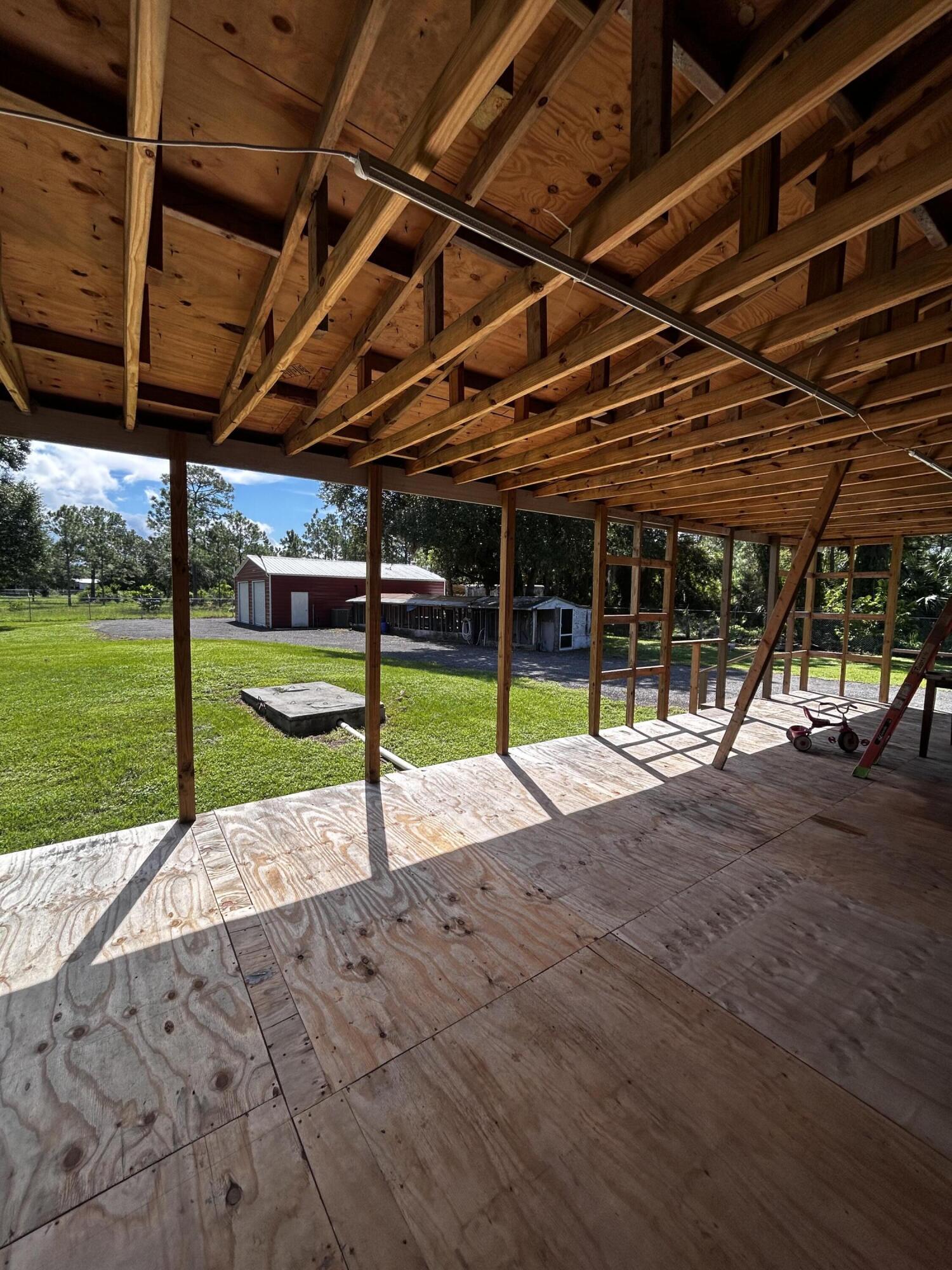 425 South Quebrada Street Clewiston, FL 33440 - Photo 50 of 56 a view of a backyard with swimming pool