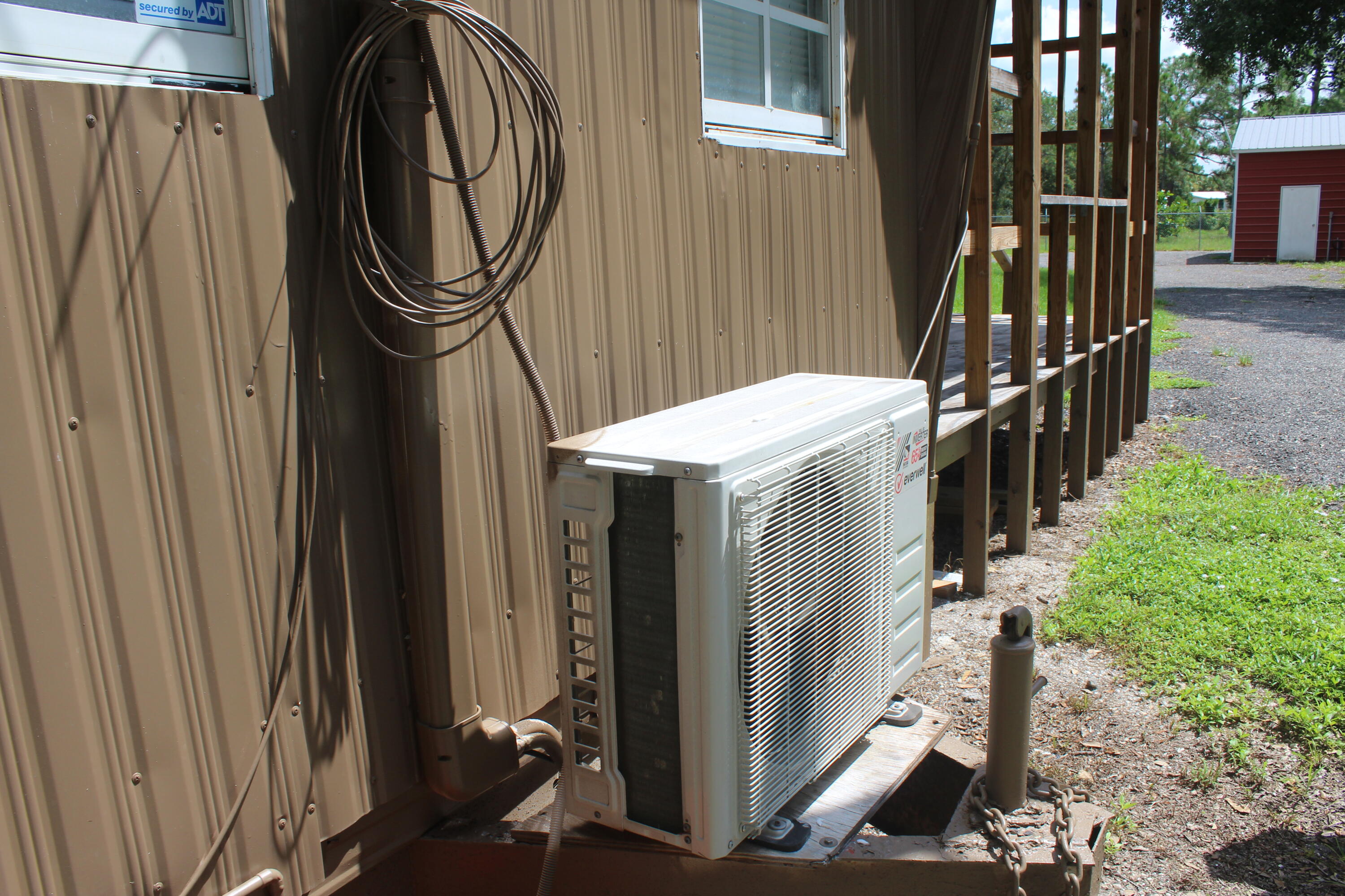 425 South Quebrada Street Clewiston, FL 33440 - Photo 55 of 56 a view of a house with street and wooden fence