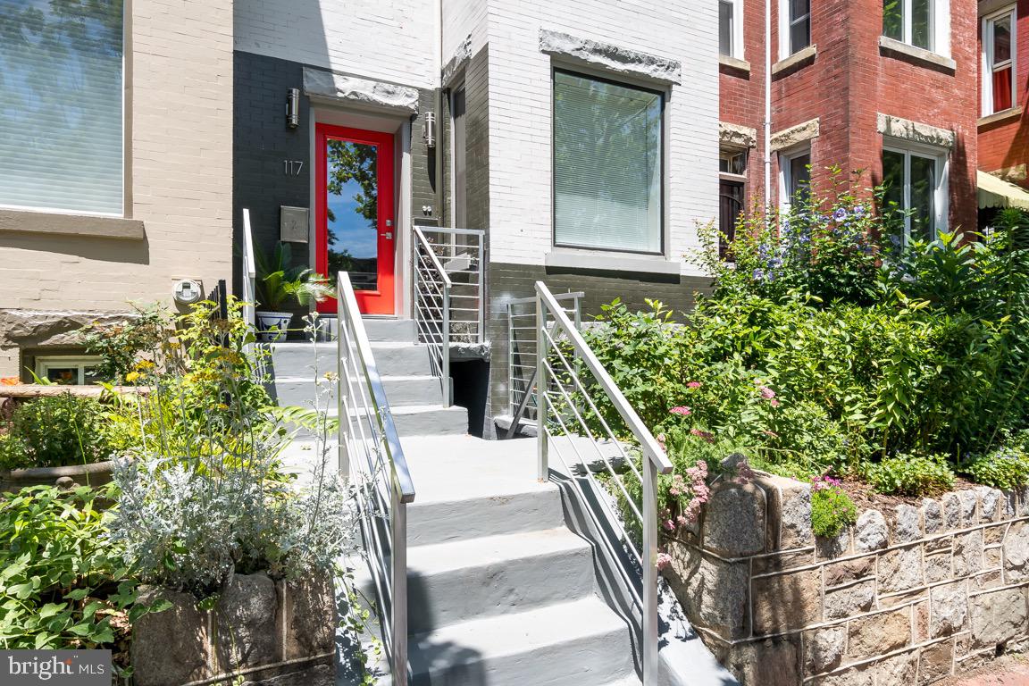 117 T Street Northwest, Unit 2 Washington, DC 20001 - Photo 2 of 32 a front view of a house with outdoor seating and plants