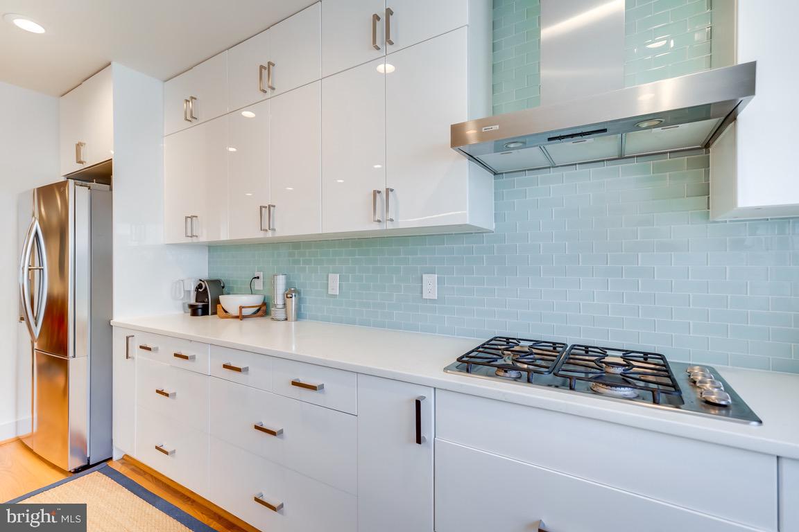 117 T Street Northwest, Unit 2 Washington, DC 20001 - Photo 11 of 32 a kitchen with stainless steel appliances cabinets and a counter top space