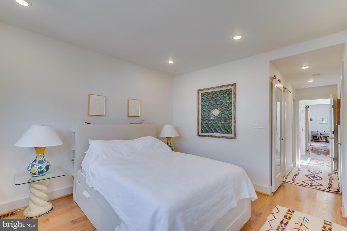 117 T Street Northwest, Unit 2 Washington, DC 20001 - Photo 20 of 32 a bedroom with a bed and a couch