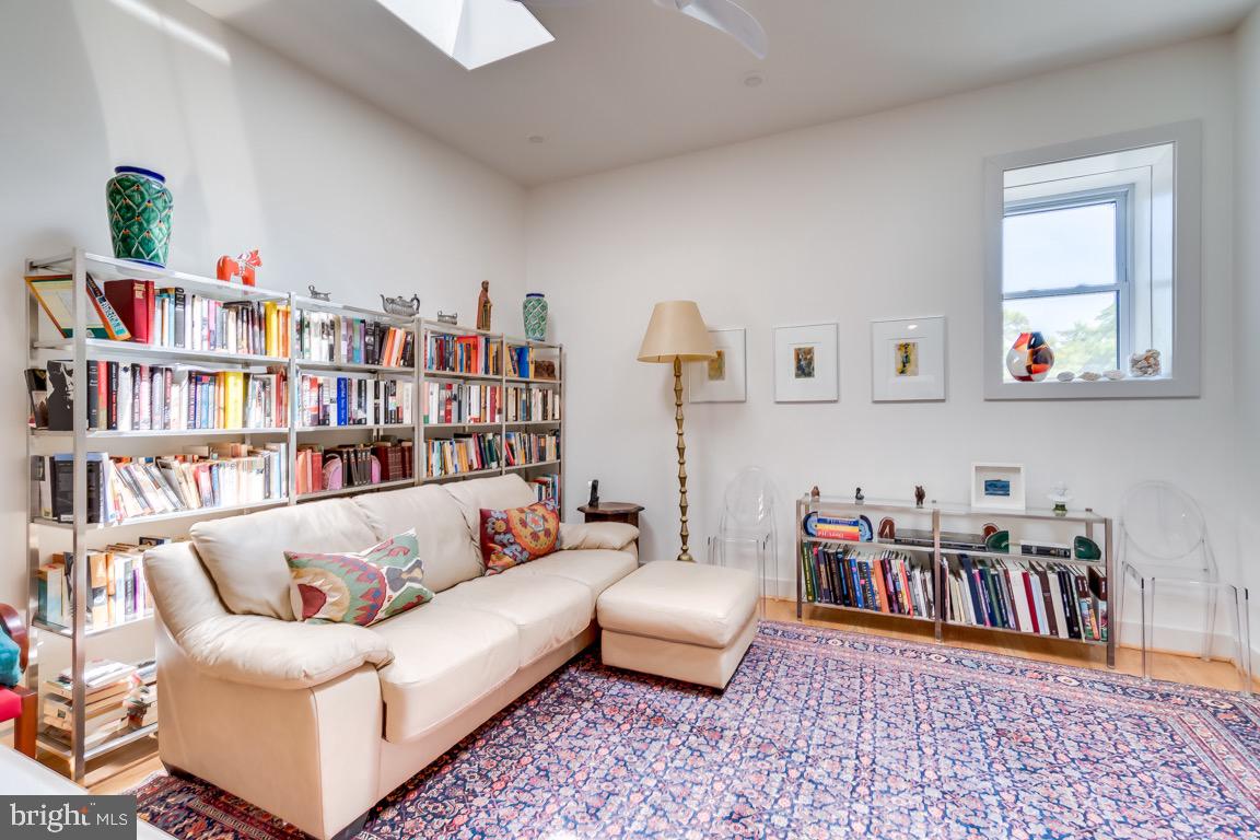 117 T Street Northwest, Unit 2 Washington, DC 20001 - Photo 23 of 32 a living room with furniture and a book shelf